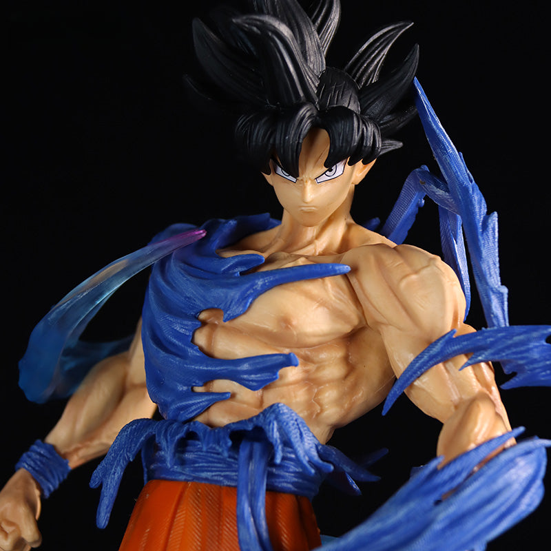 The Seakoff Goku Dual Head Collectible Figure (49cm) captures the essence of Dragon Ball Z with its Super Saiyan Blue and Ultra Instinct heads. Featuring a muscular pose, spiky black hair, blue energy effects, orange pants, and a determined expression set against a black background.