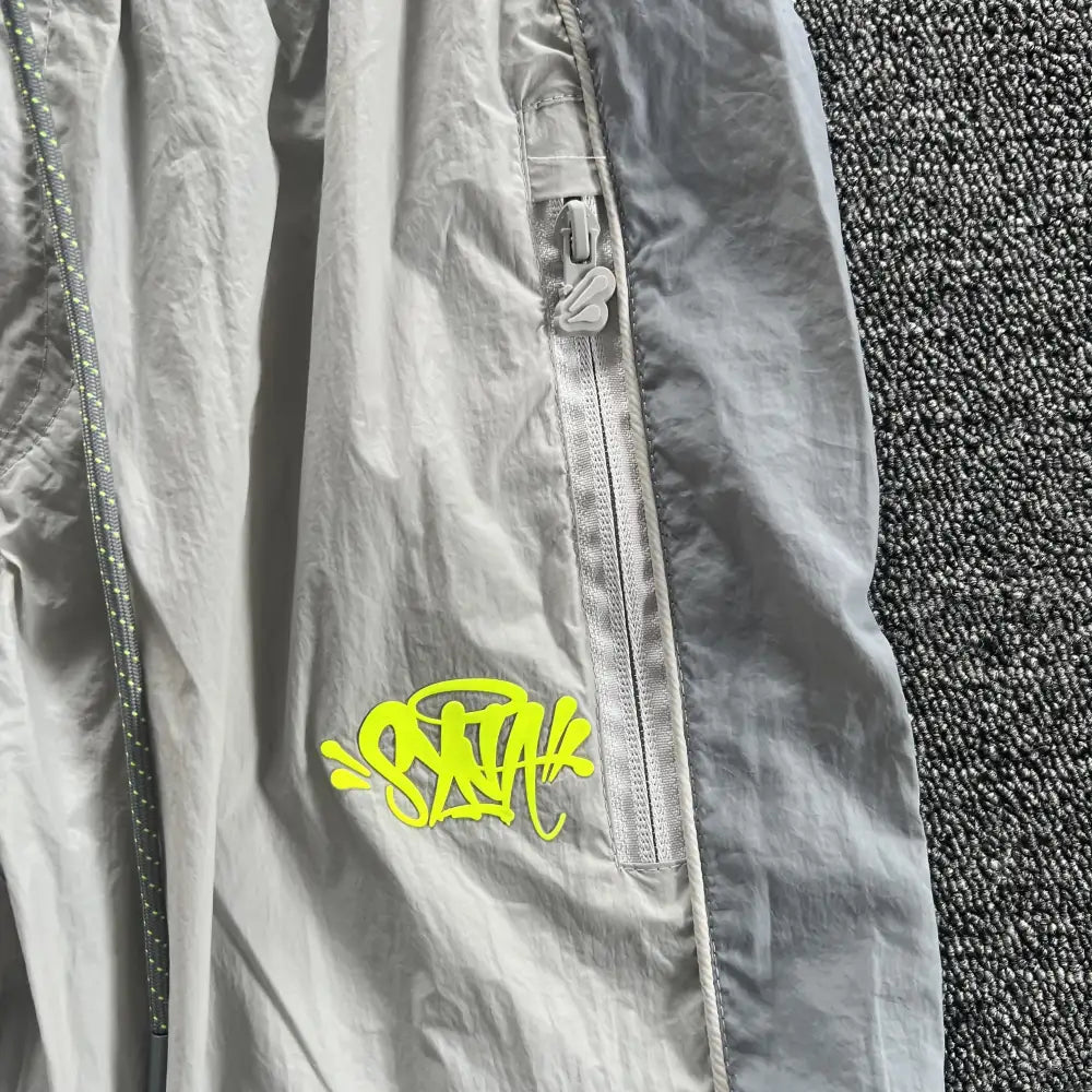 Syna World Grey Yellow Logo Track Pants