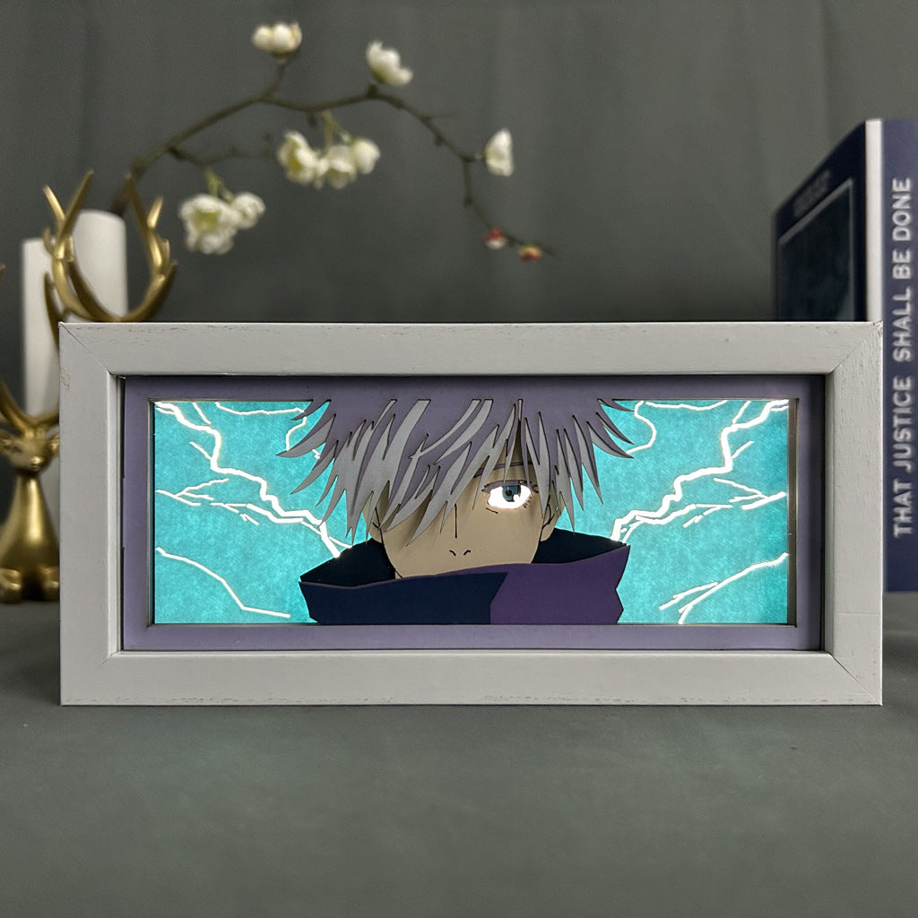 The Jujutsu Kaisen Anime Light Box – Gojo Satoru 3D Effect is an LED decor piece featuring an animated character with spiky gray hair and a high collar against a turquoise lightning-patterned background. This elegant 16-color adjustable light box enhances any space alongside plants or books.