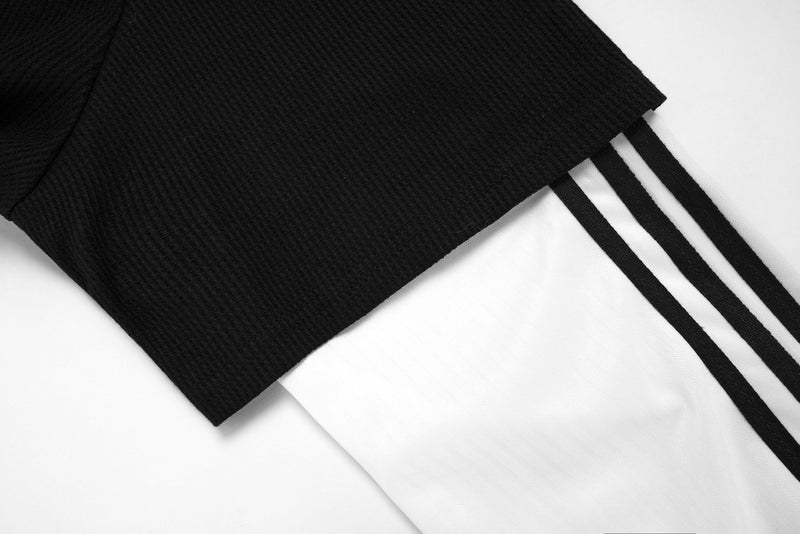 Black sleeve cuff with white underlayer and two black stripe details
