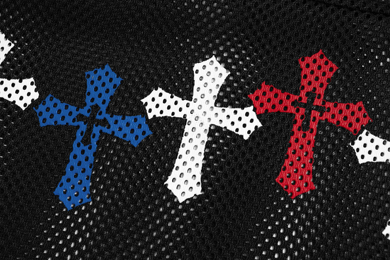 Close-up of black mesh jersey fabric with blue, white, and red cross graphics and perforated athletic texture