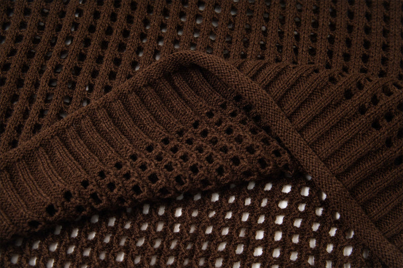 Close-up of brown open-knit sweater fabric and ribbed neckline