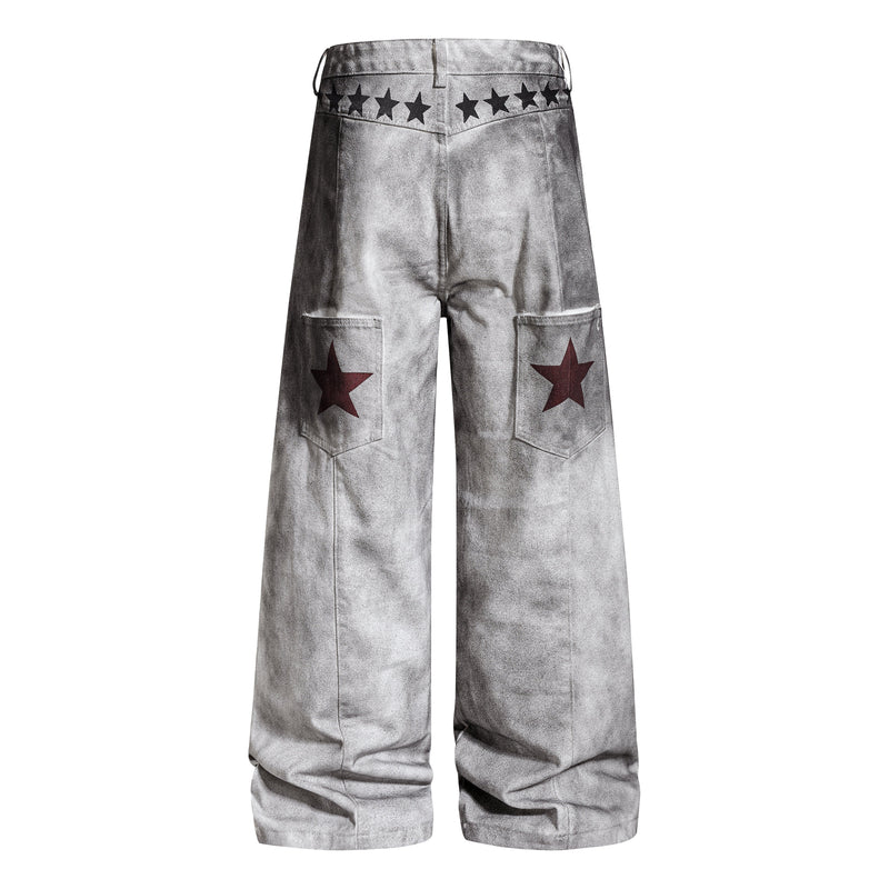 Back view of gray washed wide-leg pants with star waistband detail and red star patches on back pockets