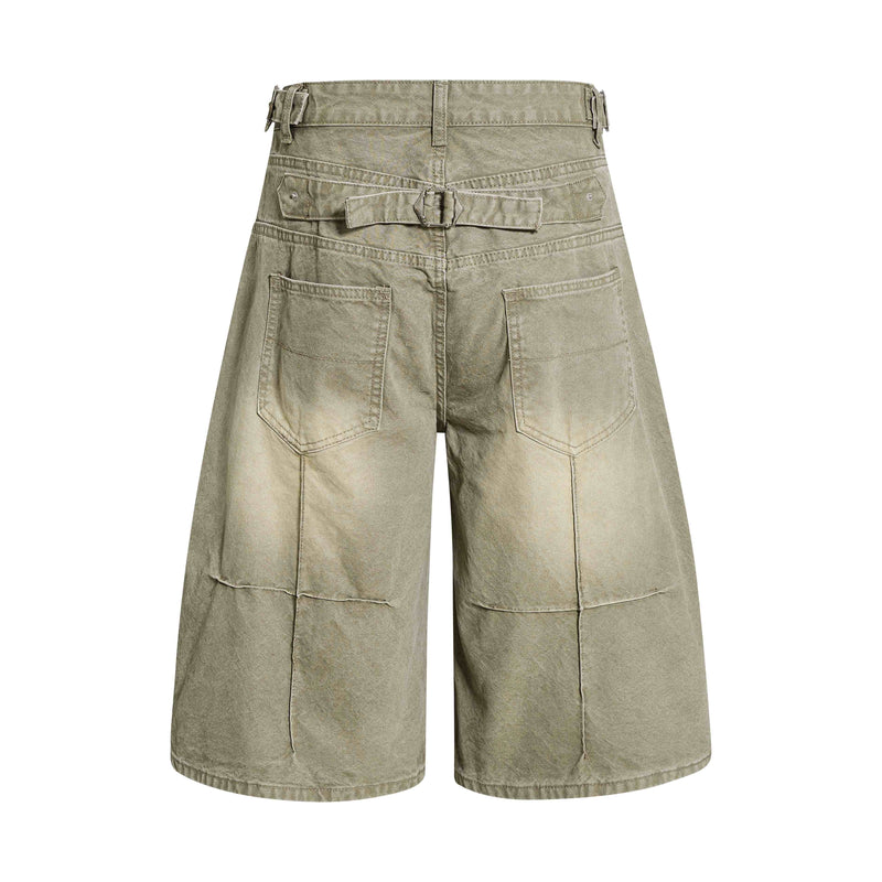 Back view of olive green wide-leg denim shorts with belt and patch pockets