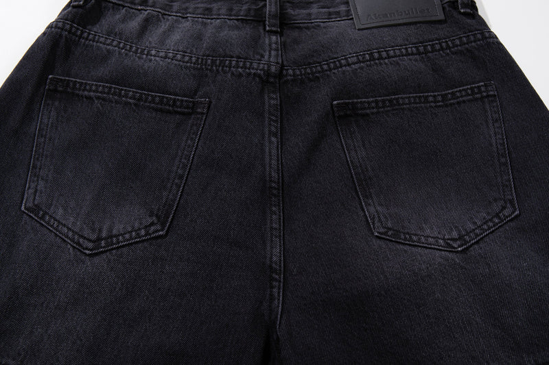 Back view close-up of dark wash jeans with two patch pockets and center seam