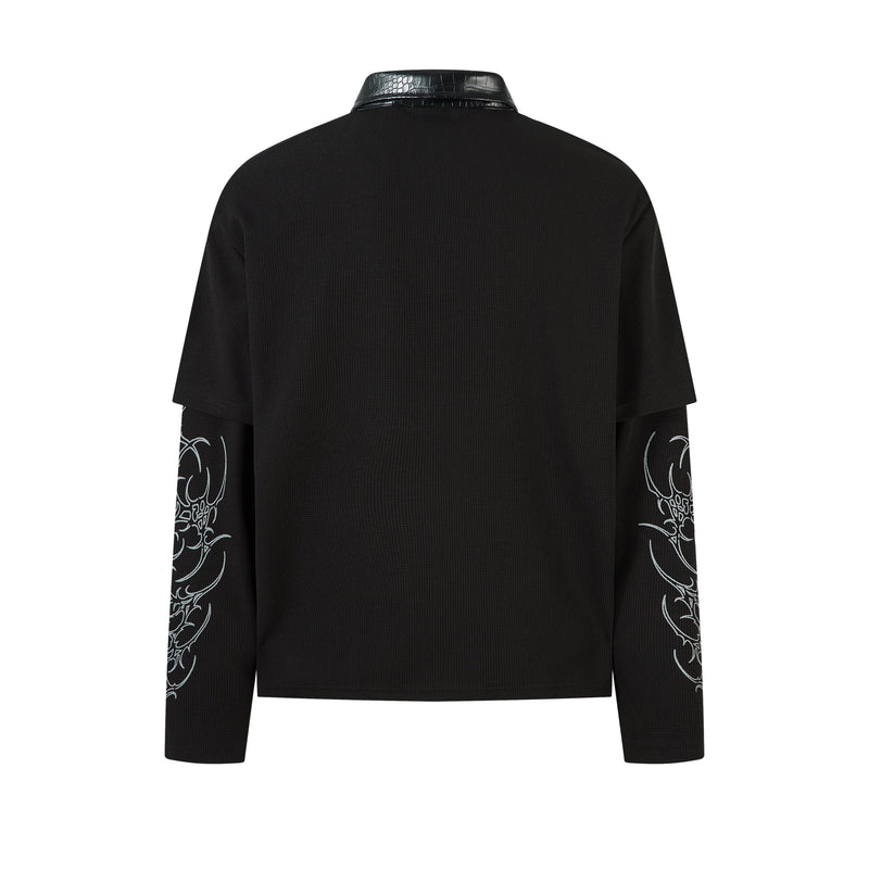 Back view of black layered long sleeve polo shirt with printed sleeves and plain back