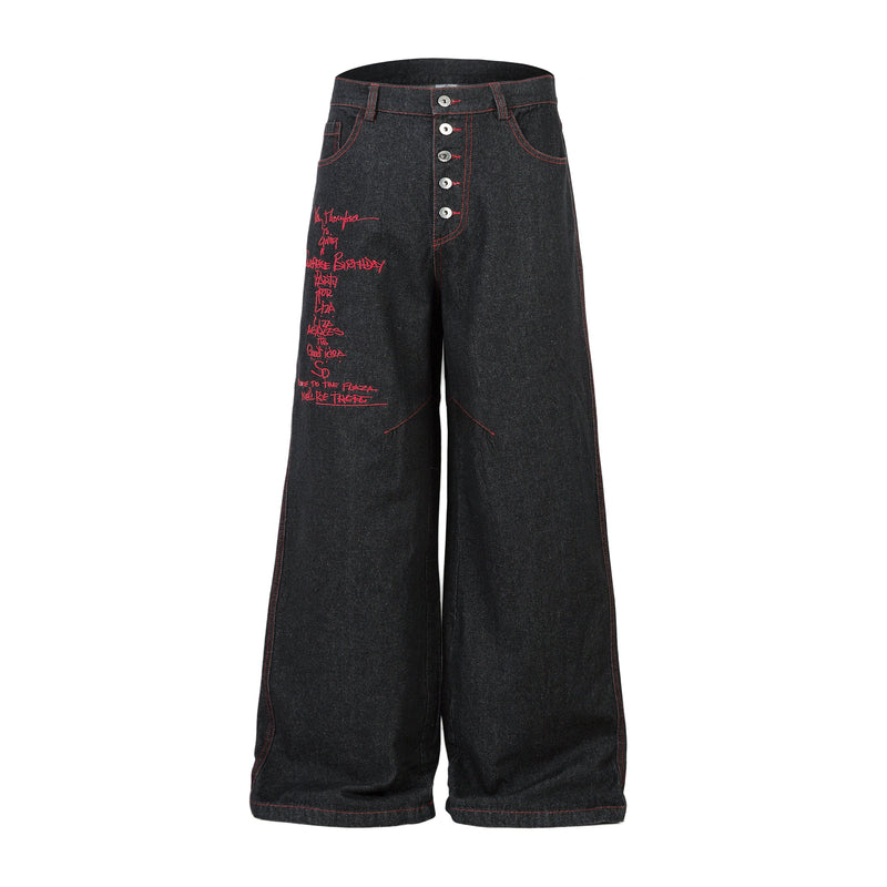 Front view of black wide-leg jeans with red stitching and red script embroidery