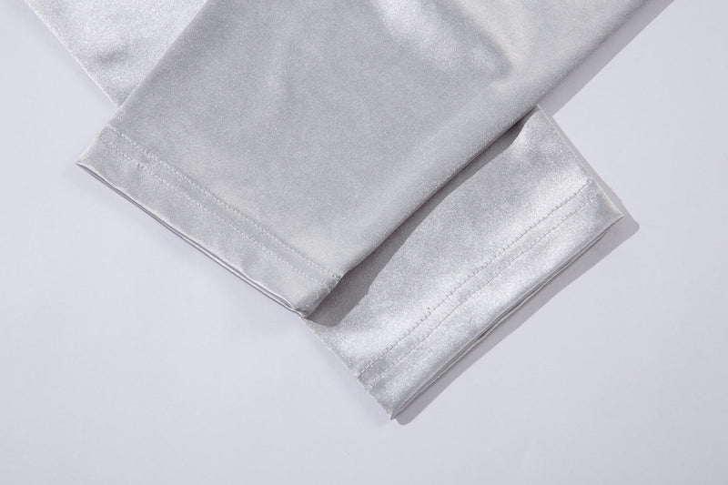 Close-up of white jersey tee cuff and hem stitching