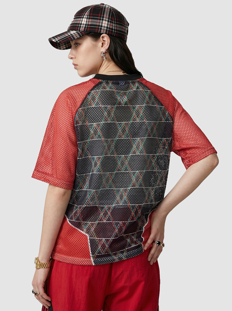 Red mesh varsity jersey T-shirt with black plaid back panel and color block streetwear styling