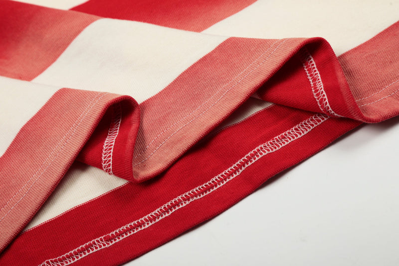 Close-up of sleeve cuff and stitching on cream and red striped rugby polo shirt