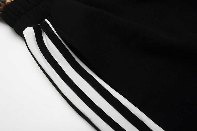 Close-up of black side stripe trim on the shorts leg
