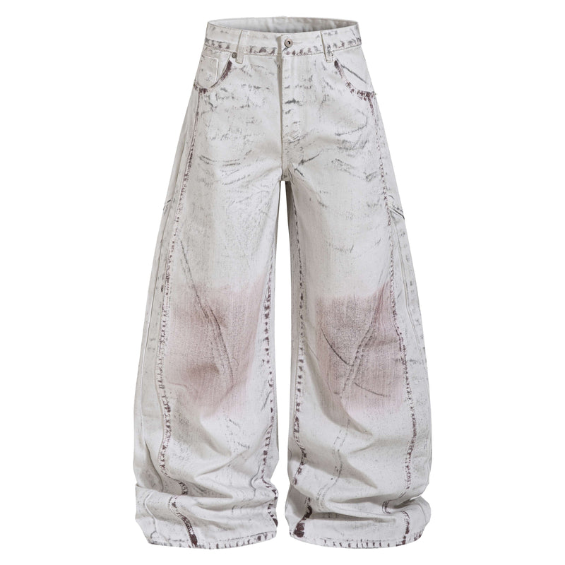 Front view of washed wide-leg denim pants in white with brown marbled panel stitching
