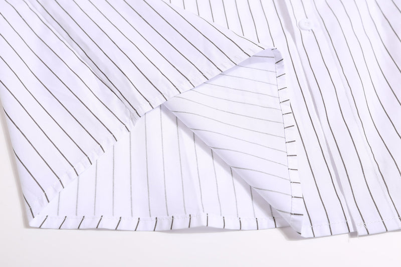 Close-up of white pinstripe jersey sleeve laid flat with cuff and button placket visible