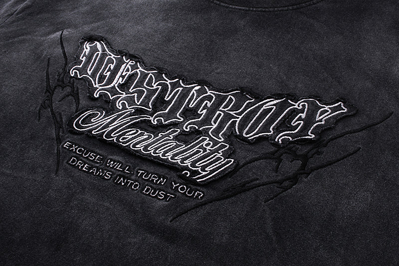 Close-up of Destroy Mentality front graphic on black washed long sleeve tee
