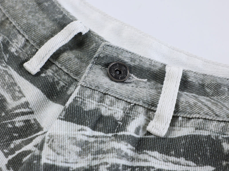 Close-up of waistband button and white drawstrings on gray printed pants