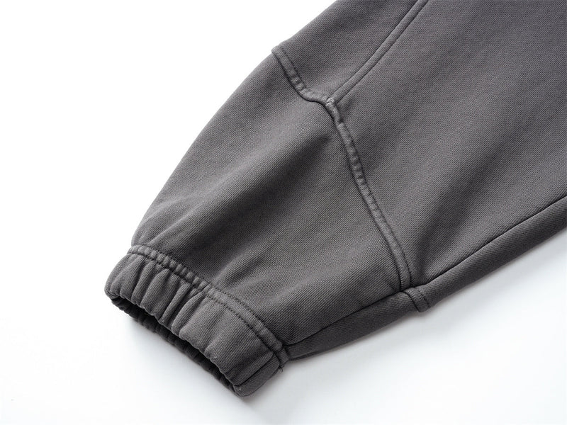Close-up of black hoodie sleeve cuff with ribbed trim