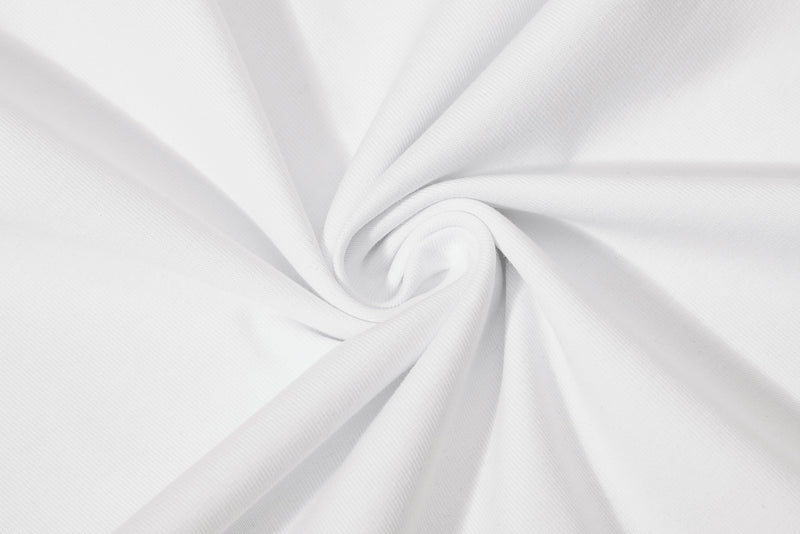 Close-up of white cotton polo fabric with soft spiral folds and smooth textured weave