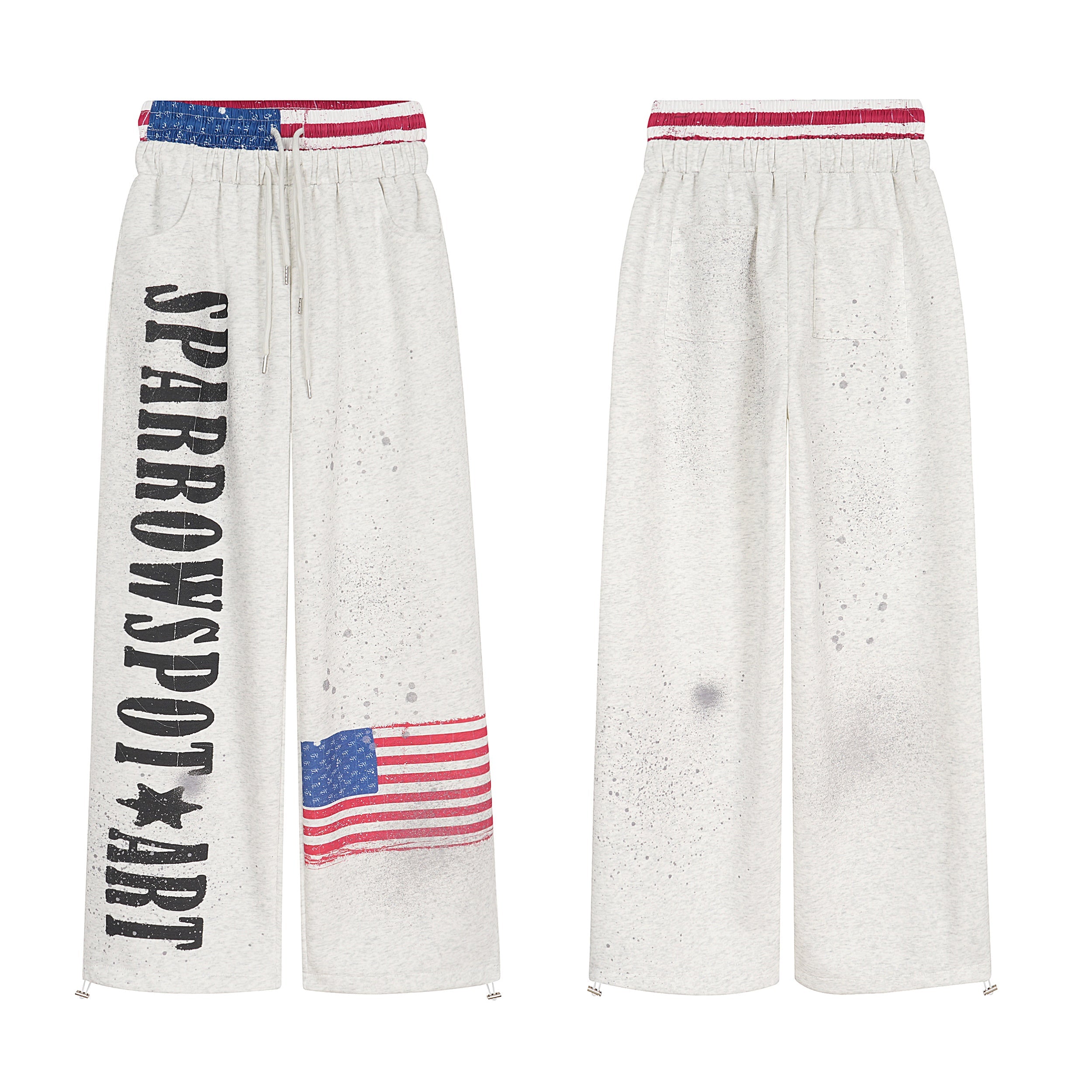 Heather grey wide-leg sweatpants with vertical streetwear lettering, American flag graphic, paint splatter, and flag-print wa