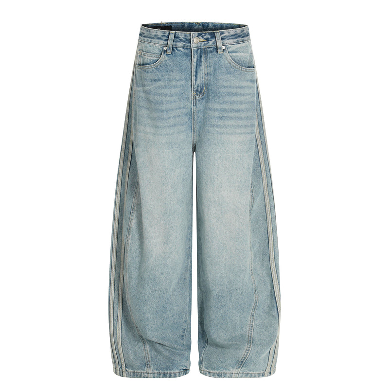 Light wash barrel jeans front view with oversized wide legs and five-pocket styling