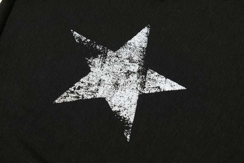 Black cotton polo tee with a distressed white star graphic on the chest, featuring a streetwear-inspired design