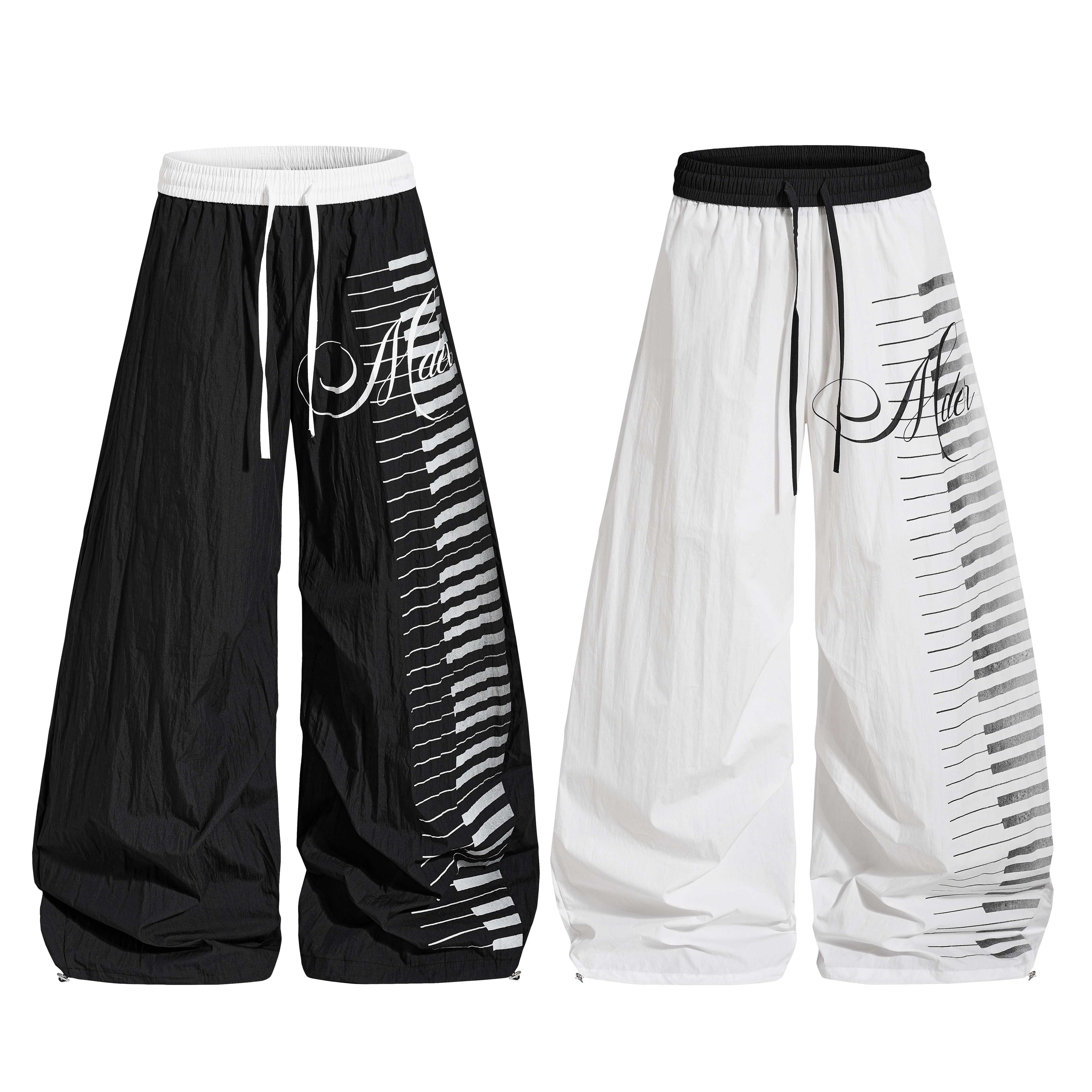 Omirad balloon pants in black and white with piano keyboard graphic print and wide oversized leg silhouette