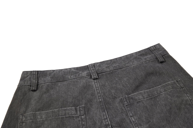 Close-up of dark gray back waistband and pocket tabs