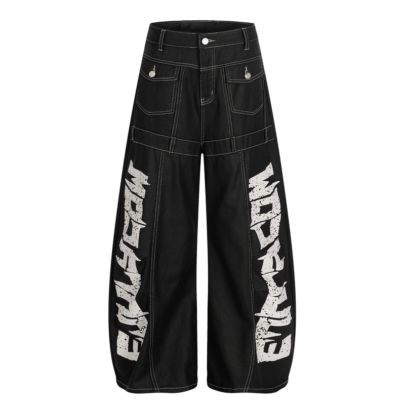 Black wide leg denim pants with white contrast stitching and graffiti print on the legs, front view