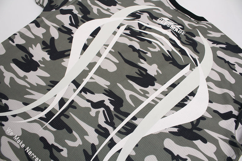 Angled close-up of the back graphic on a camo waffle long sleeve top