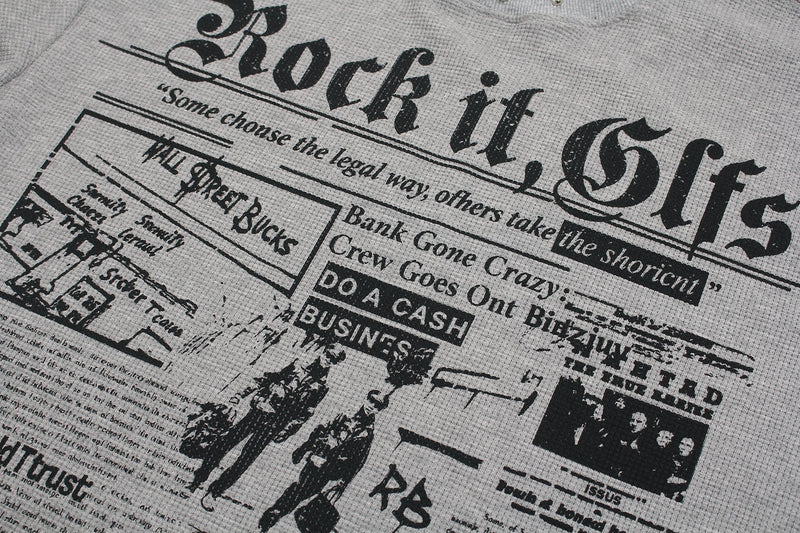 Black gothic collage graphic on a light gray Seakoff T-shirt with bold Rock it text and newspaper-style prints