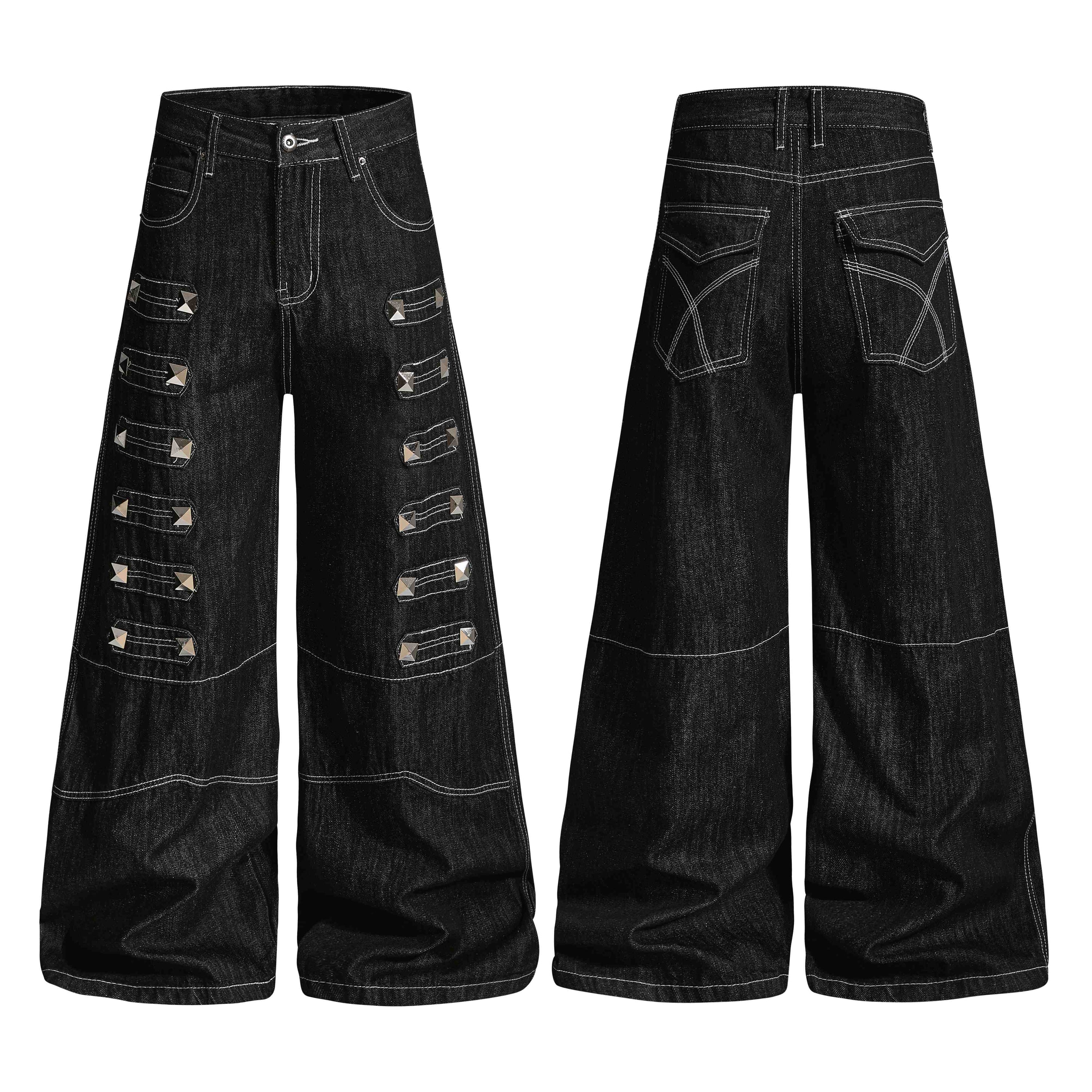 Black wide-leg denim jeans with pyramid metal studs and layered strap panels, front and back view on white background