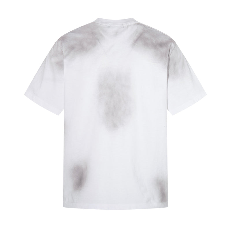 White oversized T-shirt with faded distressed collage print on the back, laid flat against a clean white background
