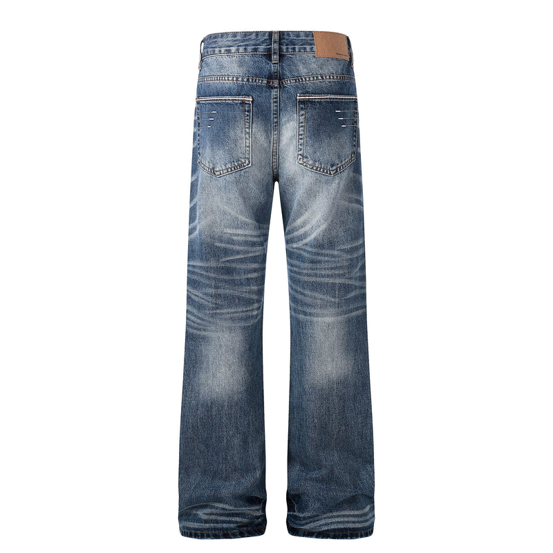 Back view of faded blue straight-leg jeans with patch pockets and tan waistband label