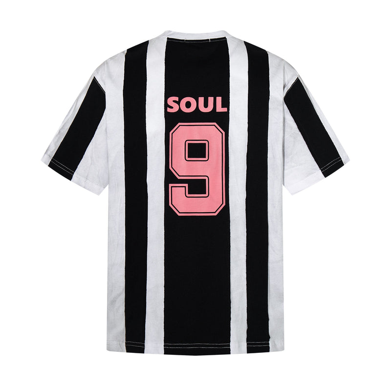 Black and white striped football jersey tee with pink SOUL 9 graphic on the back, streetwear style