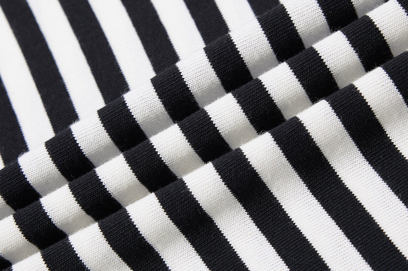 Black and white striped knit fabric detail with ribbed texture, showing the Seakoff streetwear tee material pattern