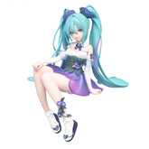 The Hatsune Miku Fairy 13.5cm PVC Figure features a playful pose of a seated female character with long teal twin ponytails, dressed in a white and purple floral dress with matching shoes, reminiscent of fairy-inspired design. Ideal for display by the brand Hatsune Miku.