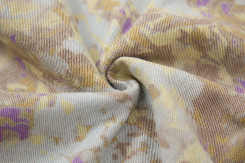 Close-up of the abstract camo cotton fabric texture with soft folds