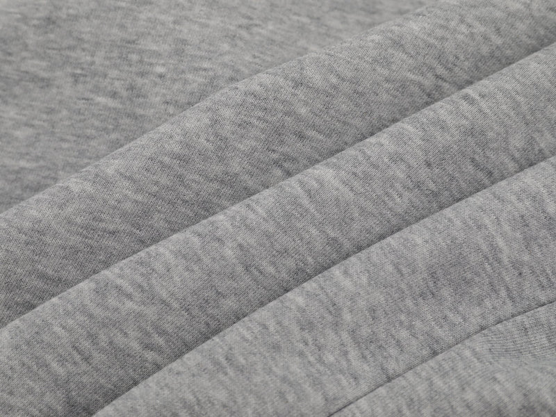 Close-up of gray sweatshirt fabric with smooth knit texture