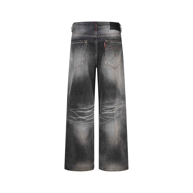 Back view of faded black wide-leg jeans with back pockets and dark waistband patch