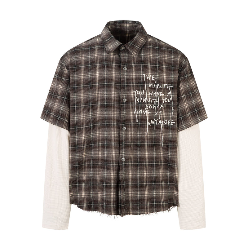 Brown plaid short-sleeve button-up shirt layered over cream long sleeves