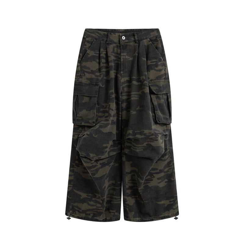 Dark camo cargo pants with wide legs and multiple flap pockets, front view