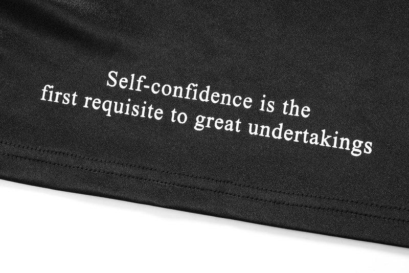Close-up of sleeve text reading Self-confidence is the first requisite to great undertakings