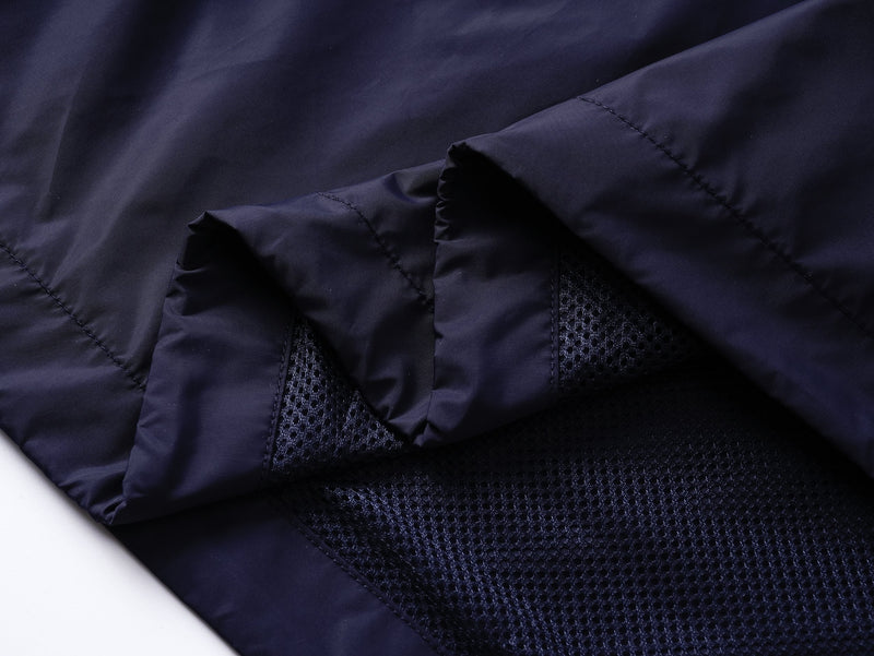 Close-up of navy nylon fabric and mesh side panel