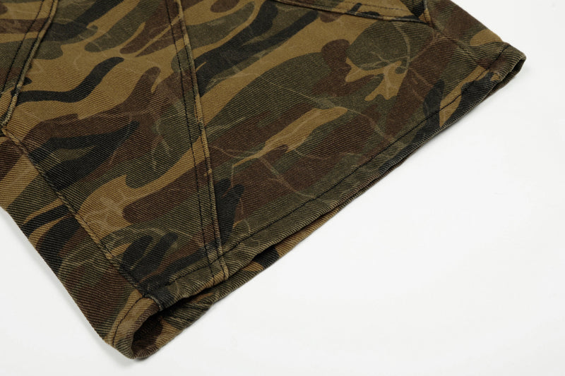 Close-up of camo shorts hem with stitched wide-leg opening