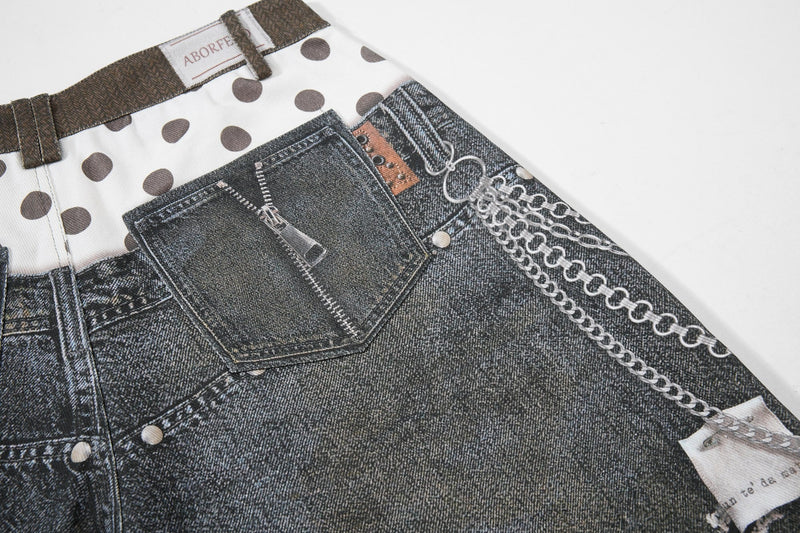 Back pocket close-up with zipper detail, brand patch, and chain print on denim