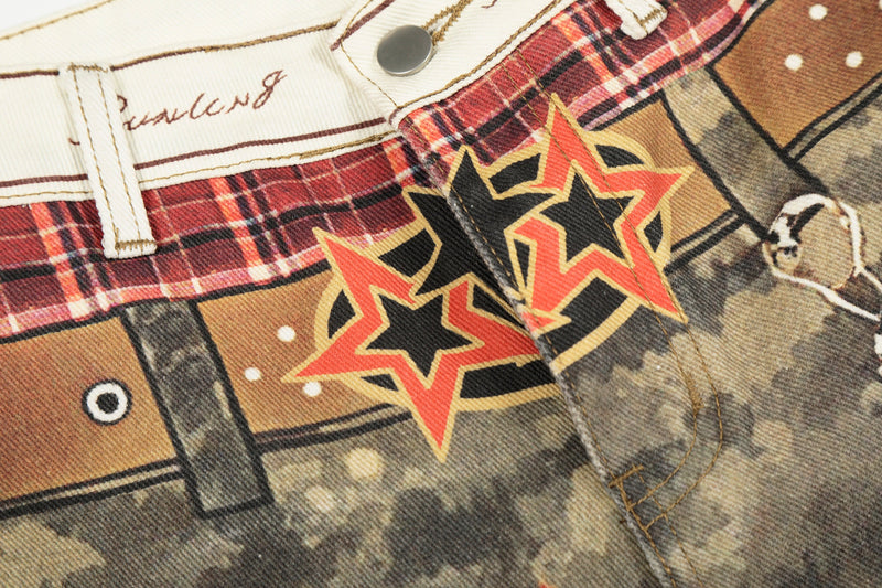 Close-up of star graphic patch and plaid waistband on camo patchwork denim pants
