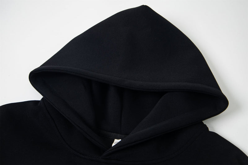 Close-up of black hoodie hood and seam with smooth fleece texture