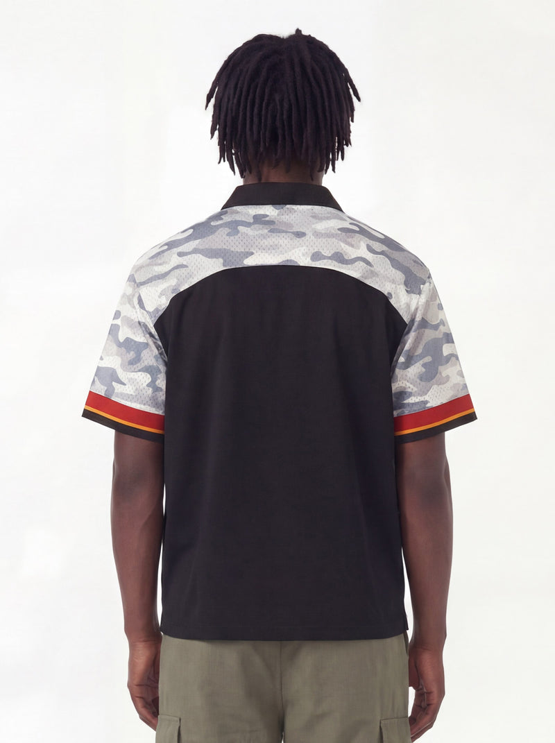 Black streetwear button-up shirt with gray camo shoulder panels and red-orange sleeve trim, shown from the back