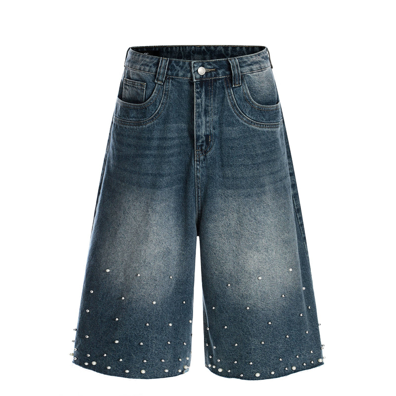 Front view of vintage wash wide-leg denim shorts with pearl stud accents