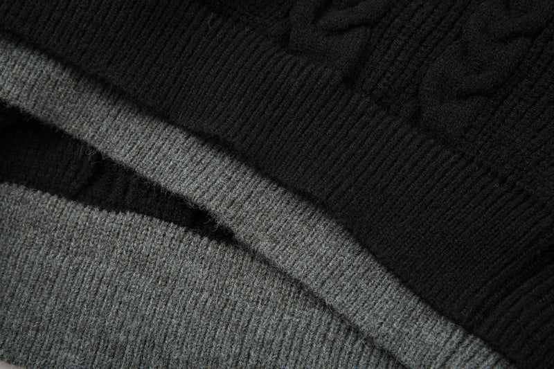 Close-up of black, gray, and beige knit fabric layers with ribbed texture