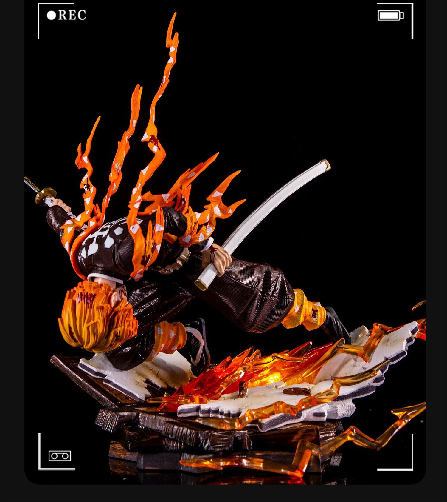 The Rengoku Kyojuro Demon Slayer Figure features the Flame Hashira in an action pose with a sword, boasting orange hair and armor-like clothing. Crafted from high-quality PVC, it&